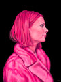A woman with a bob haircut in a pink fur coat is shown in profile against black, inspired by Caia Koopman’s "Margot in Pink." This monochromatic pink artwork celebrates Spoke Art's 15th Anniversary.
