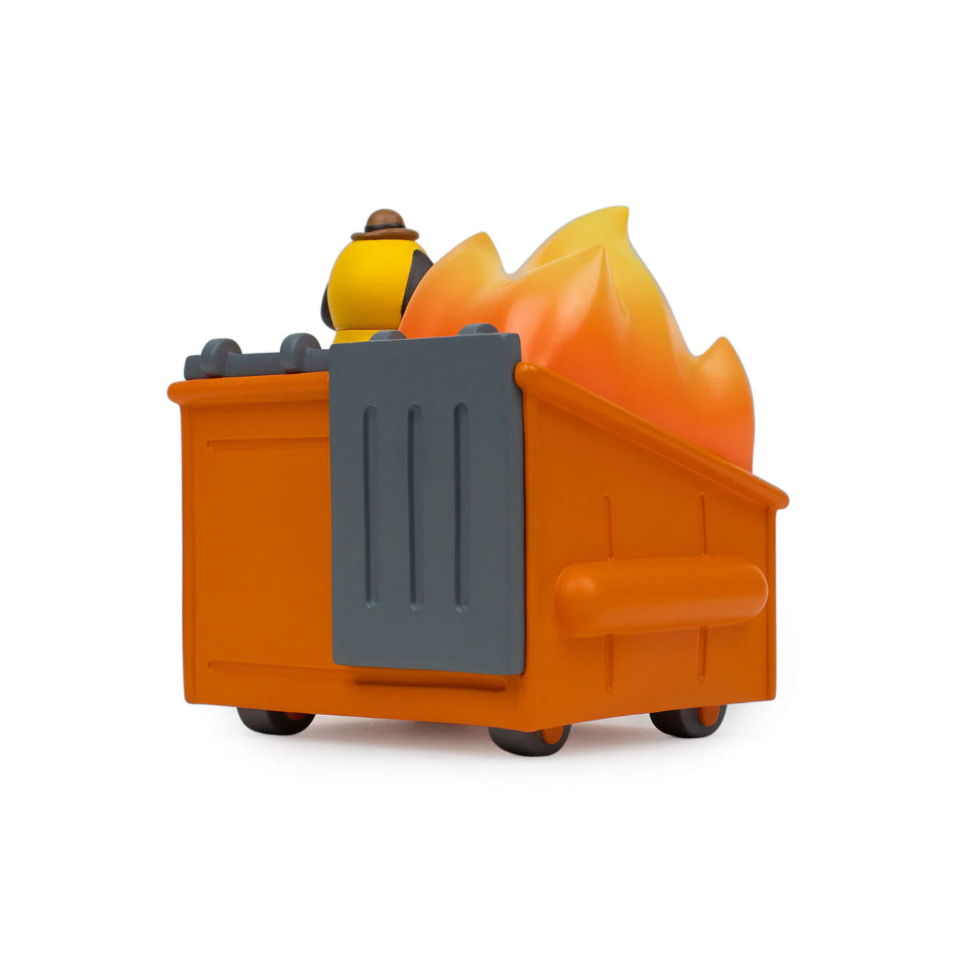 A 100% Soft Dumpster Fire vinyl figure, inspired by the This is Fine meme, featuring a toy dumpster with flames and a small yellow figure in a brown hat inside. The background is plain white.