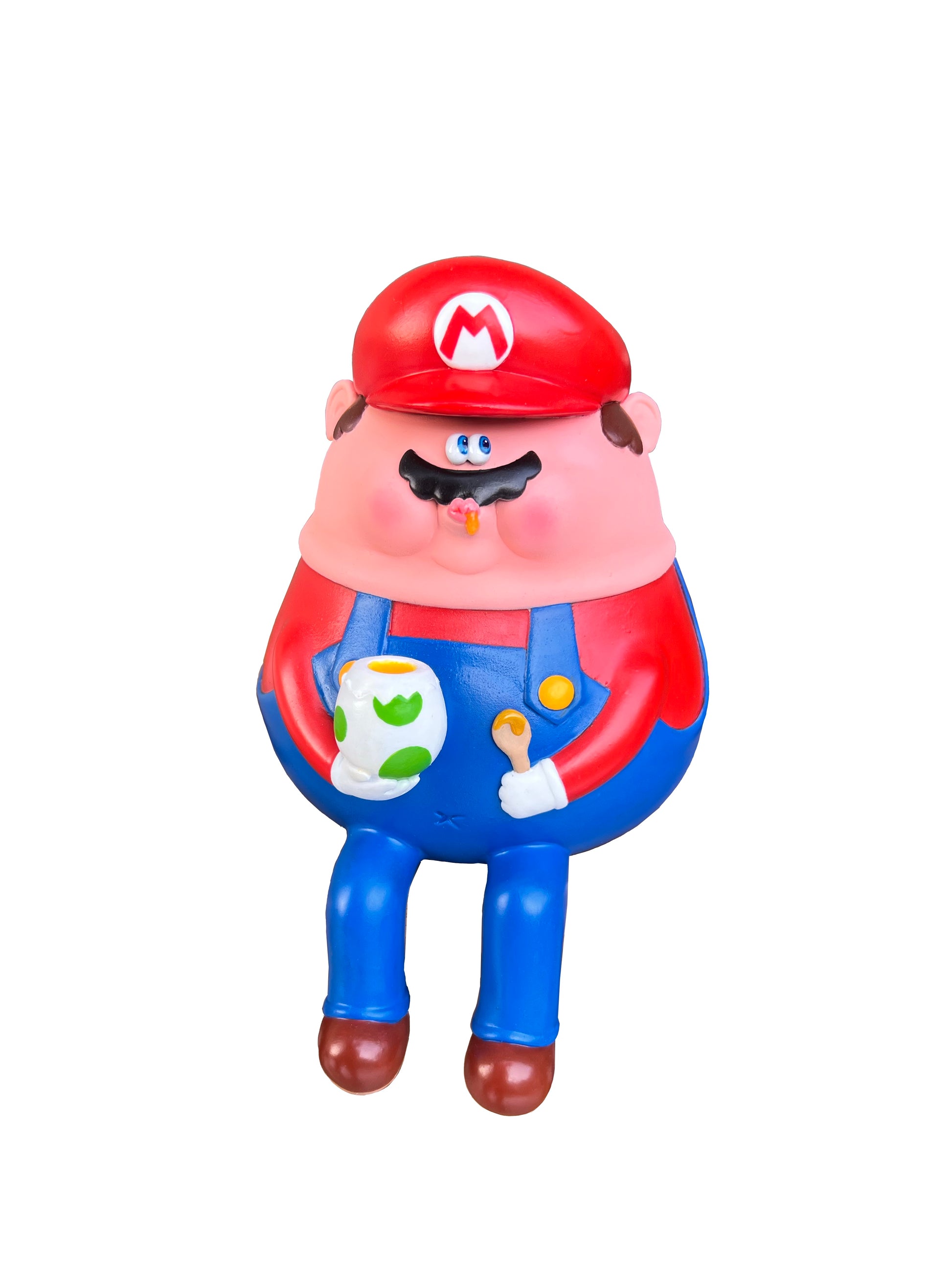 A Sad Salesman epoxy clay figure of a cartoonish plumber in red hat and blue overalls, with a mustache and pink skin, holding a green and white spotted egg and spoon—a playful nod to Super Mario Bros art, isolated on white.