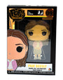 A FUNKO Pop! Pin of Pam Beesly from The Office is displayed in its black box packaging, labeled as number 09. This collectible enamel pin features Pam Beesly wearing a pink cardigan and skirt, with The Office series logo and FUNKO Pop branding clearly visible.