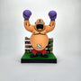 Geoff Trapp's artwork depicts a cartoon King Hippo: a bald, muscular boxer with purple gloves, red shorts, and an expressive face raises his arms triumphantly, sporting a belly bandage and standing before a boxing ring.