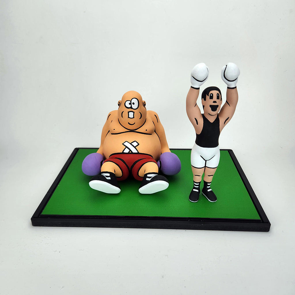 Two animated character figurines on a green platform with a white background