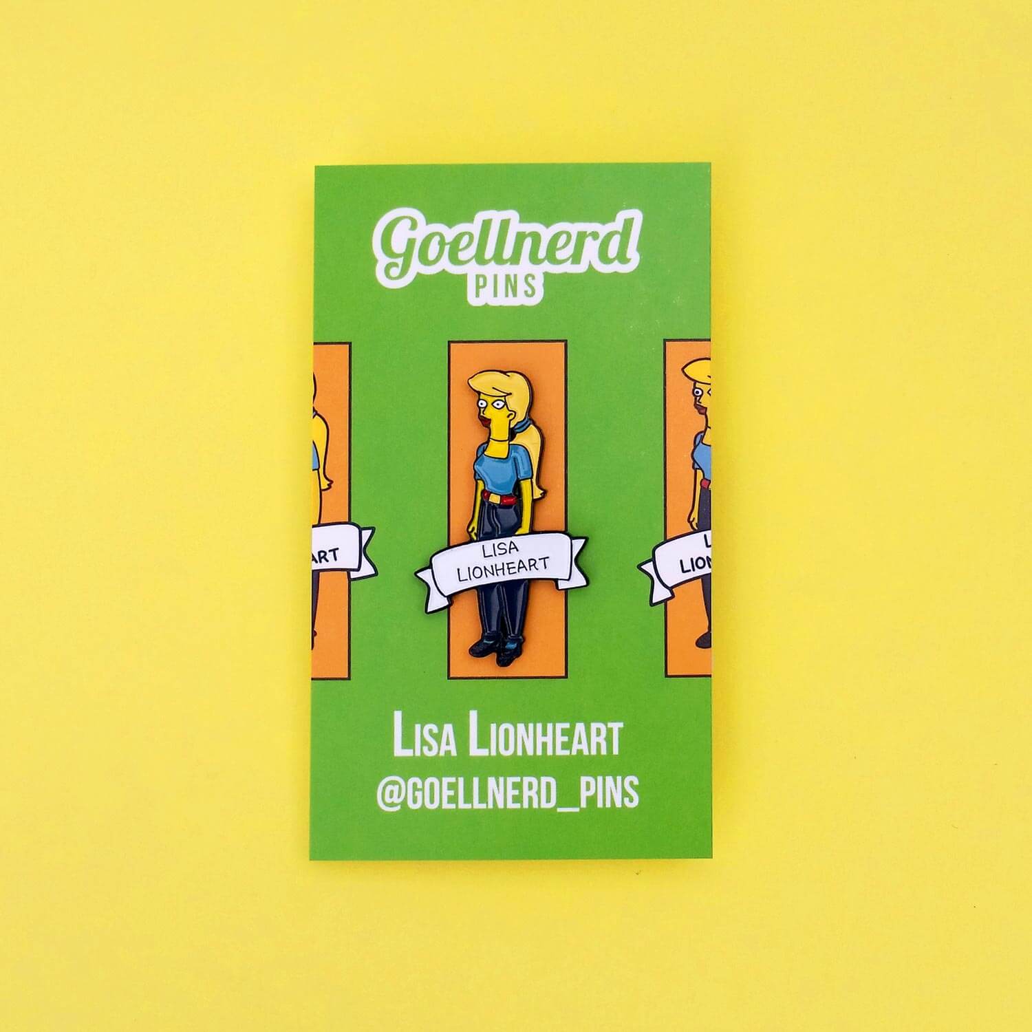 A Lisa Lionheart hard enamel pin resembling Lisa Simpson is displayed on a green card with Spoke Art branding and contact info, set against a yellow background.