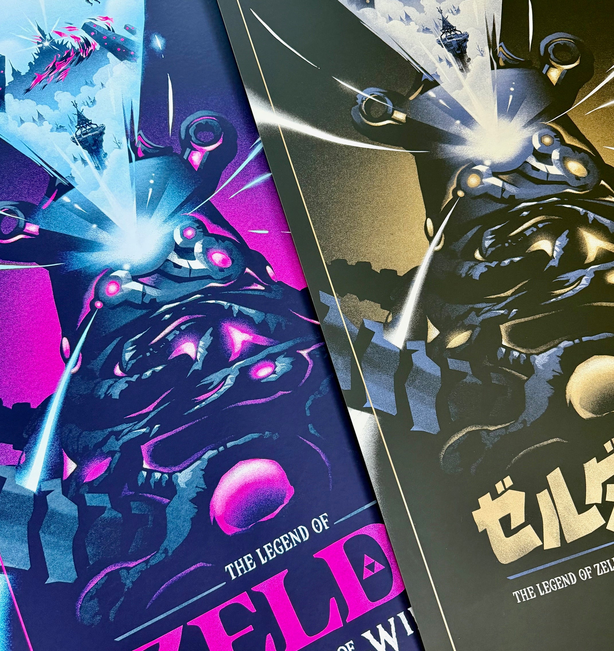 Lyndon Willoughby offers two comic-style screen prints featuring dynamic, futuristic battle scenes with explosions and ships. These covers for The Legend of Zelda: Breath of the Wild showcase purple/blue hues on one and gold/black on the other, with English and Japanese text.