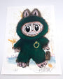 A whimsical Joey Feldman archival pigment print shows a wide-eyed character in a furry green costume with pink ears, claws, and tail on a light background. It features a gold ring and is signed at the bottom.