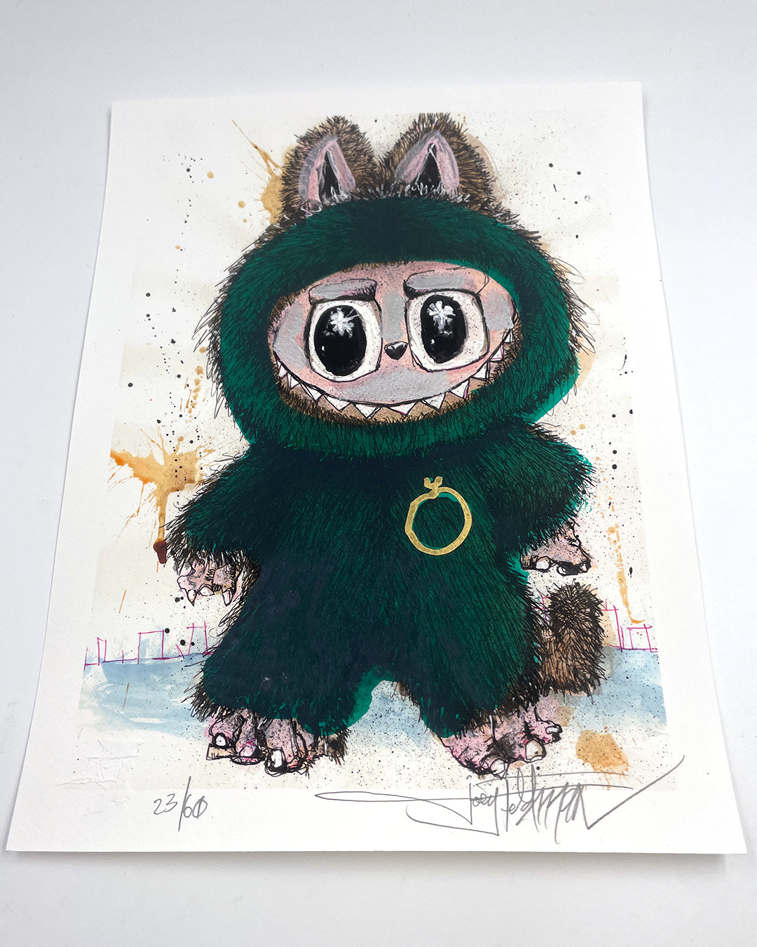 A Joey Feldman archival pigment print depicting a wide-eyed character in a fuzzy green bear suit with large paws and a gold chest ring, accented by brown and pink splashes. Numbered and signed at the bottom.