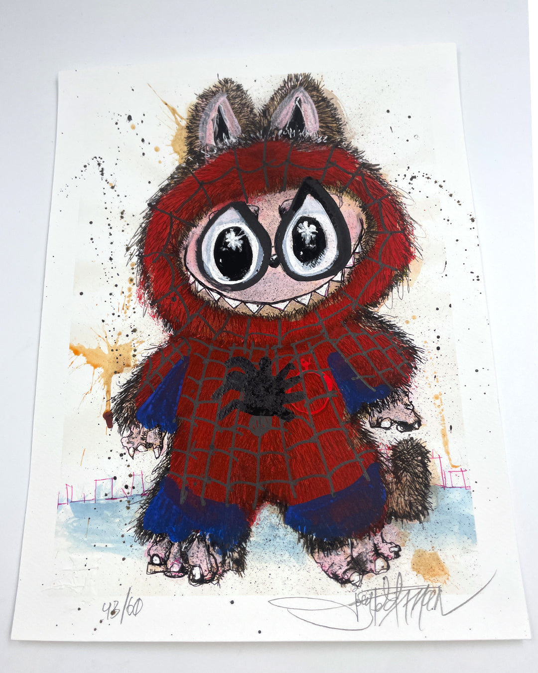 This archival pigment print by Joey Feldman depicts a wide-eyed furry creature in a Spider-Man suit, with big ears and paws. Featuring splashes of paint and hand-painted touches, its signed and numbered 43/60 at the bottom.