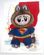 A whimsical Joey Feldman illustration of a wide-eyed creature in a furry costume, donning a blue Superman suit and red cape on a splattered red and yellow background, finished with hand-painted embellishments.