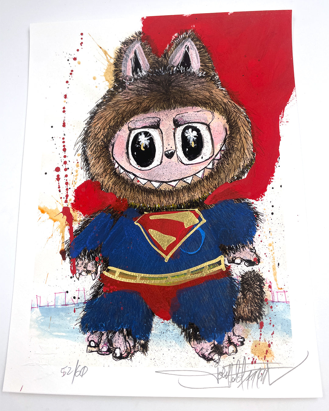 A whimsical Joey Feldman illustration of a wide-eyed creature in a furry costume, donning a blue Superman suit and red cape on a splattered red and yellow background, finished with hand-painted embellishments.