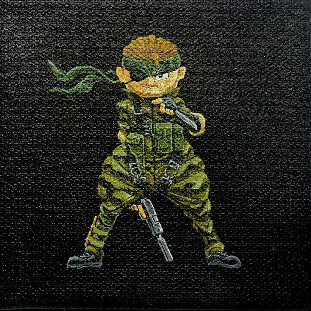 An illustrated character by Joshua Budich, inspired by Solid Snake, stands in green camo and headband with a rifle, confidently pointing forward against a textured black background—evoking classic Metal Gear video game art.