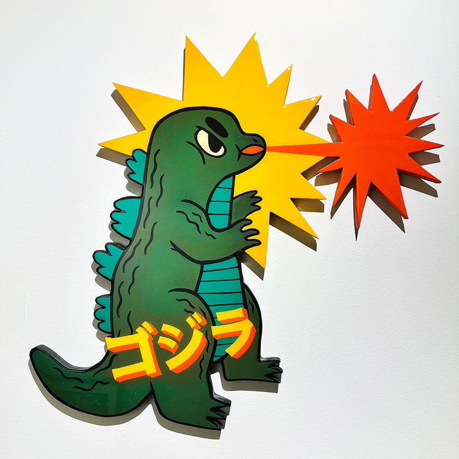 Wall sculpture made of acrylic and epoxy of an animated version of Godzilla blowing out fire.