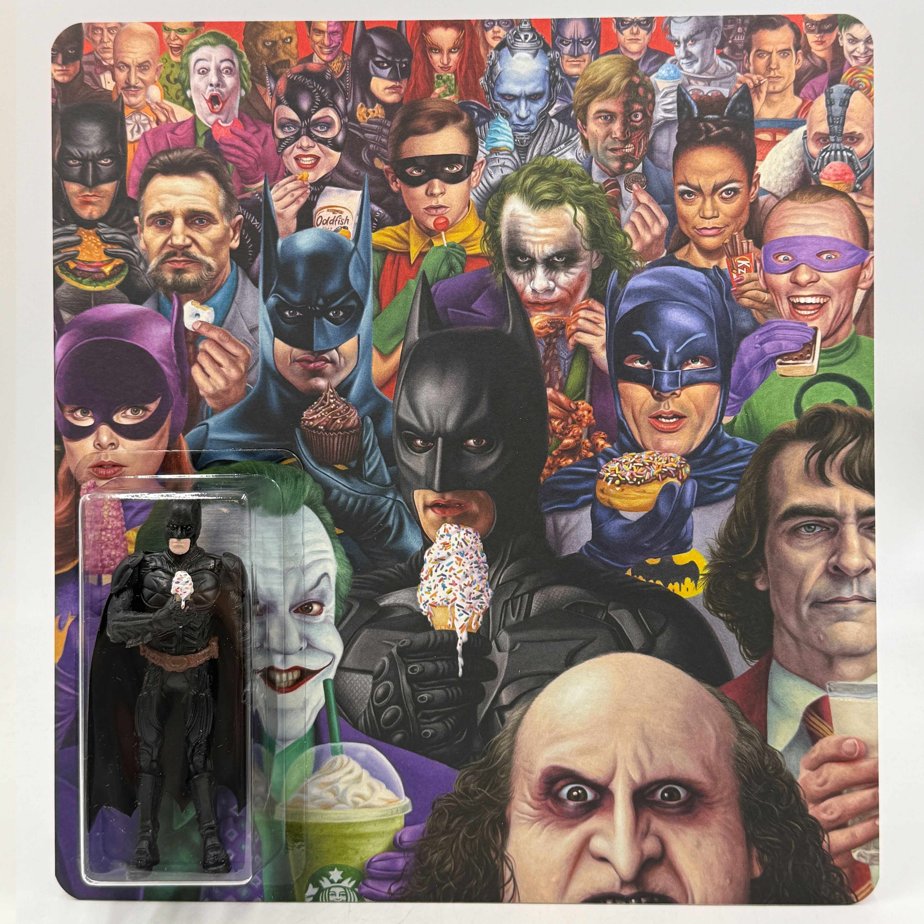 Alex Gross Batman action figure holding an ice cream in packaging. This unique collectible from artist Alex Gross features a hand-cast resin figure, signed and numbered by the artist. The background displays illustrated scenes of Batman characters and villains—including the Joker, Penguin, Catwoman, and more from across various Batman adaptations—enjoying ice cream and treats, making it a must-have addition for any fan’s collection.