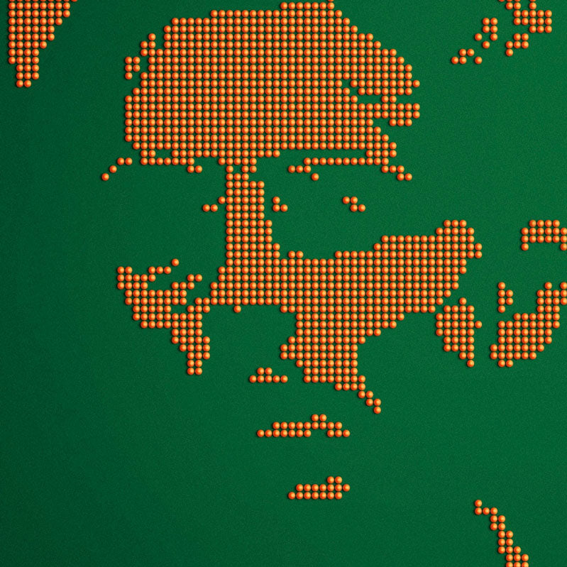 A portrait of a man's face made from rows of orange ping pong balls on green, in Akiko Stehrenberger's bold screen print style, with "Marty Supreme" and "Made in America" text displayed below. Brand: Akiko Stehrenberger.