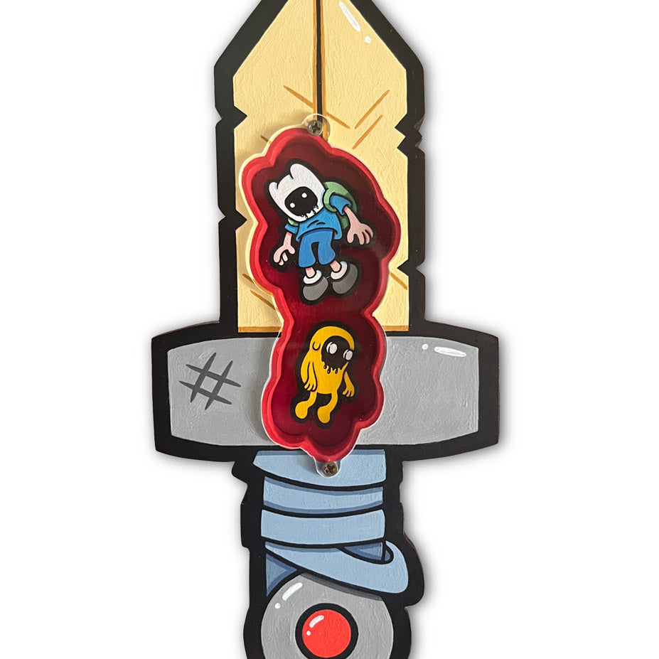 A cartoon-style Misadventures artwork from Spoke Art features a sword with a yellow blade and gray hilt. Two animated characters, one blue and one yellow, are in a red heart shape on the blade against a white background.