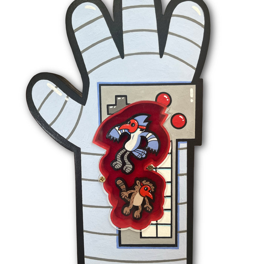 For the Spoke Art 15th Anniversary Show, Matt Ritchie’s cartoon-style painting features a gray hand-shaped oven mitt with a red center and two surprised birds on a white background, echoing the playful spirit of Irregular Show.