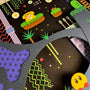 A playful collage by Michelle Romo features layered cut paper inspired by Animal Well—a retro game scene with floating platforms, stylized plants, dotted lines, a yellow phone, and a smiling yellow character set against a dark background.