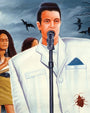 A man in a bright white Deadly Prey suit sings seriously into a microphone, evoking Stop Making Sense. Two women stand behind him as bats fly in the cloudy sky and a large brown bug crawls on his suit pocket.