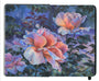 painting in an open face Moleskine notebook of large lush roses in a garden at dusk by artist Nicole Gustafsson