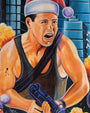 A muscular man in a black tank top and Santa hat grimaces, clutching a futuristic gun. Amid explosions and skyscrapers, his arm bleeds—a striking Deadly Prey digital print inspired by Nii Bi Ashitey.