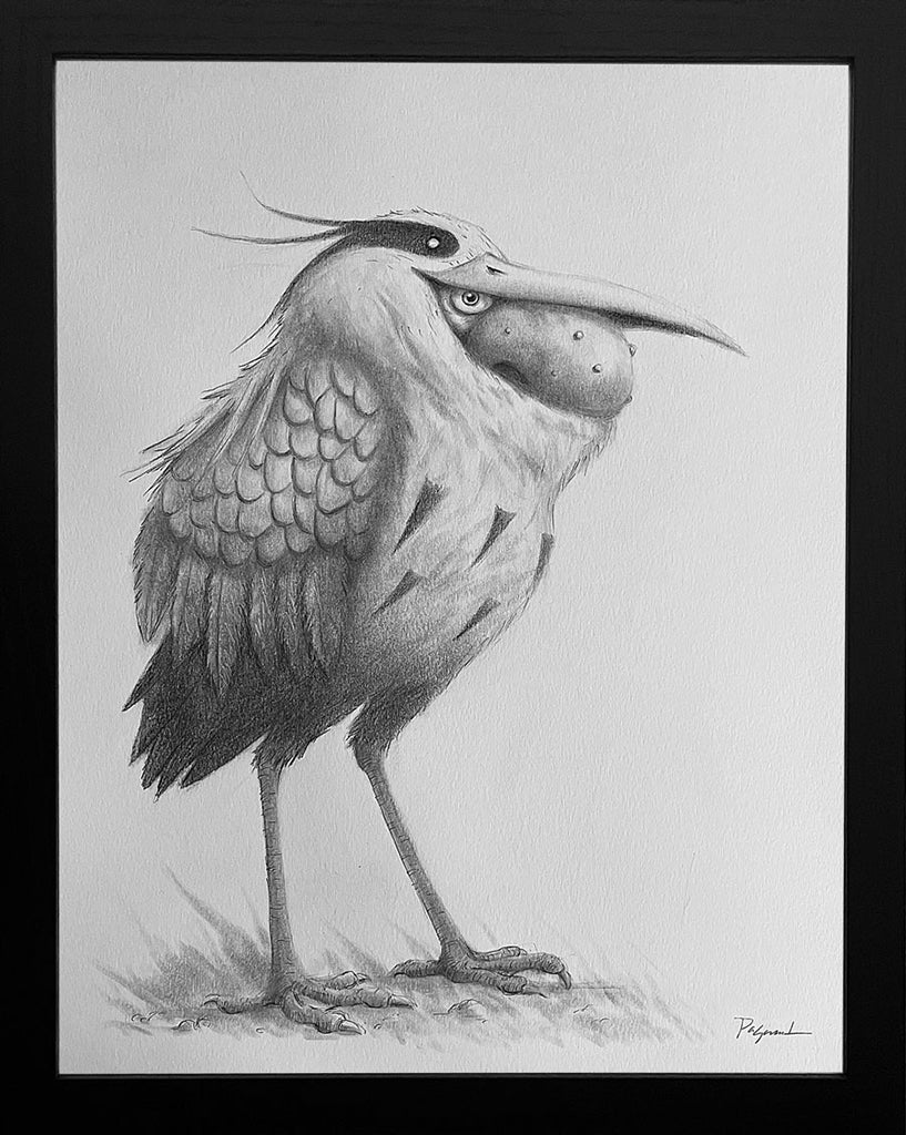 Graphite artwork by Ruel Pascual, framed in black by Spoke Art, features a whimsical, bird-like creature with shaggy feathers, long legs, expressive eyes, and a large beak reminiscent of a Grey Man Heron.