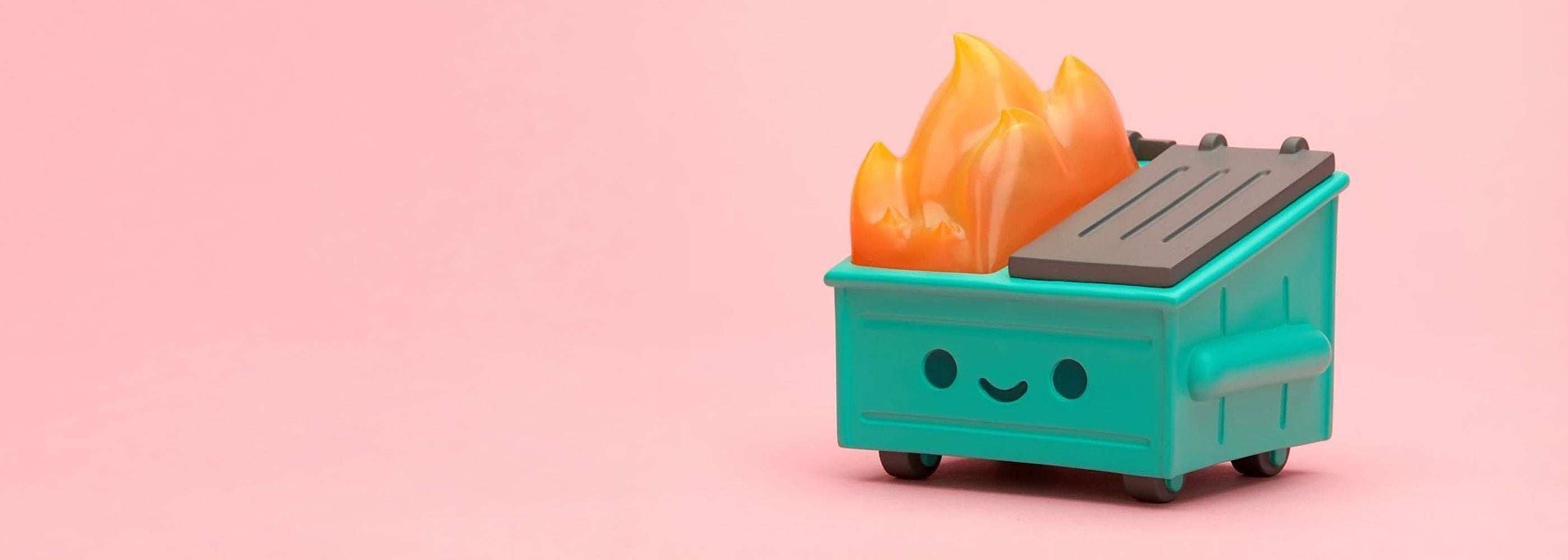 Small green robot with a smiling face holding two orange fruits on a pink background