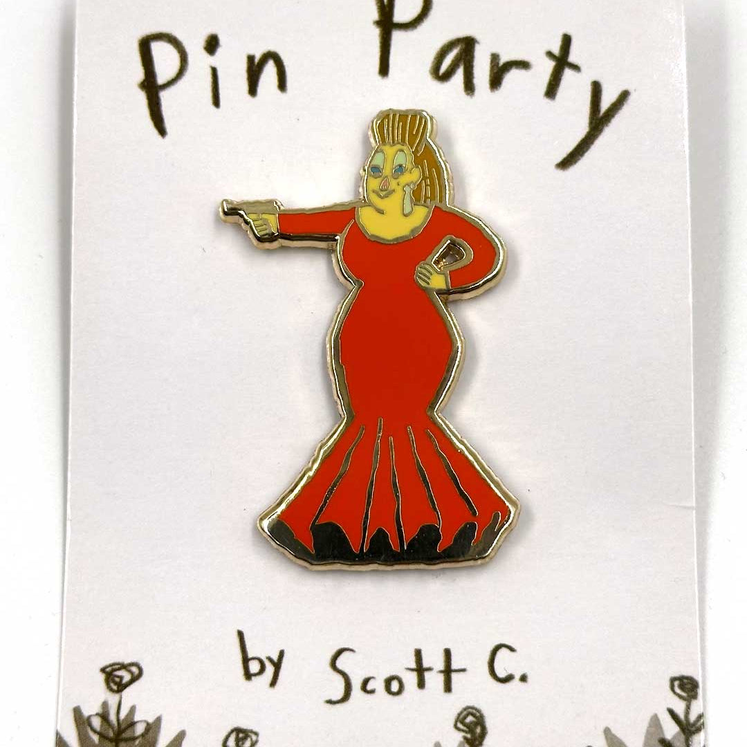 A cartoon hard enamel pin by Scott C. featuring a person in a long red dress pointing a finger-gun, displayed on a “Pin Party by Scott C.” card decorated with doodled flowers at the bottom. This gold metal plated, limited edition collectible is perfect for fans and collectors alike.