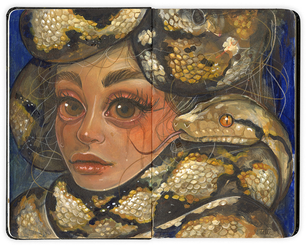 illustration on an open face Moleskine notebook depicting a crying woman with large boa snakes wrapped around her head and neck against a blue background by artist Tatiana Suarez