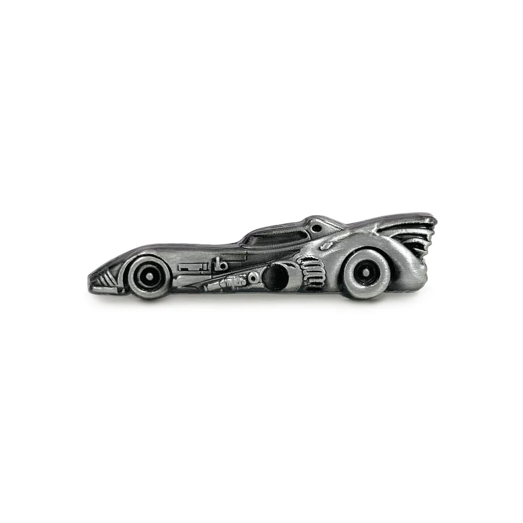 A detailed, Antique Silver Plated die-struck lapel pin by Spoke Art shaped like the Batmobile from Batman, shown in profile on a white background.