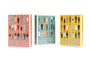Three boxes of “Max Dalton’s Playing Cards—Wes Anderson Series” (volumes one, two, and three) each showcase Max Dalton’s illustrated characters dressed in iconic outfits from Wes Anderson films, set against uniquely colored backgrounds. These custom-designed playing cards capture the quirky charm and unmistakable style that define Wes Anderson’s cinematic world.