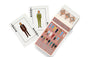 Two playing cards labeled JOKER showcase illustrated men in suits. The open box beside them, branded Max Dalton, reads Wes Anderson’s Playing Cards Volume One and features illustrated characters on the cover, reflecting custom designed playing cards created by Max Dalton.
