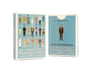Two boxes of Max Dalton’s Playing Cards Volume Two are shown. Custom designed by Max Dalton, the front features illustrated characters from Wes Anderson's films on a blue background, while the back displays a single character in a suit. Both boxes prominently show the product title, making these Max Dalton playing cards a must-have for collectors and fans alike.