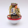 A small figurine with purple facial markings, topped with noodles, vegetables, and meat, sits in a white bowl with a red rim—Zard Apuya’s ramen-inspired vinyl toy featured at San Diego Comic-Con 2025.