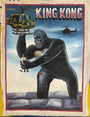 A painted poster from Deadly Prey depicts King Kong holding a woman and grabbing a helicopter, with another helicopter nearby. The KING KONG title at the top evokes the iconic Deadly Prey exhibition art style.