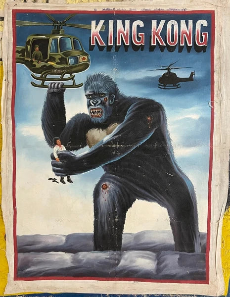 A painted poster from Deadly Prey depicts King Kong holding a woman and grabbing a helicopter, with another helicopter nearby. The KING KONG title at the top evokes the iconic Deadly Prey exhibition art style.