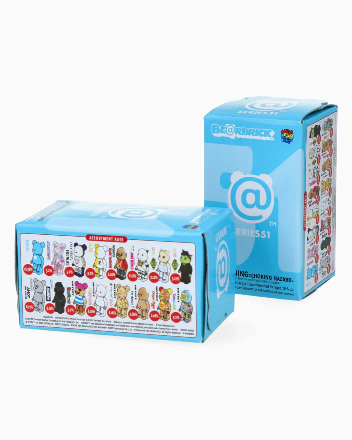 Two blue Be@rbrick Series 51 blind boxes from Medicom are displayed, featuring various collectible bear designs on the packaging, with one box standing upright and the other lying on its side.