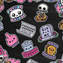 These cute, pastel goth-style vinyl stickers by 100% Soft feature phrases like “Future Corpse,” “Dead Inside,” and “Garbage Person,” alongside skeletons, gravestones, a trashcan, a pink middle finger, and a mock newspaper. With a matte finish that is both scratch- and weatherproof, the stickers are displayed on a dark background.