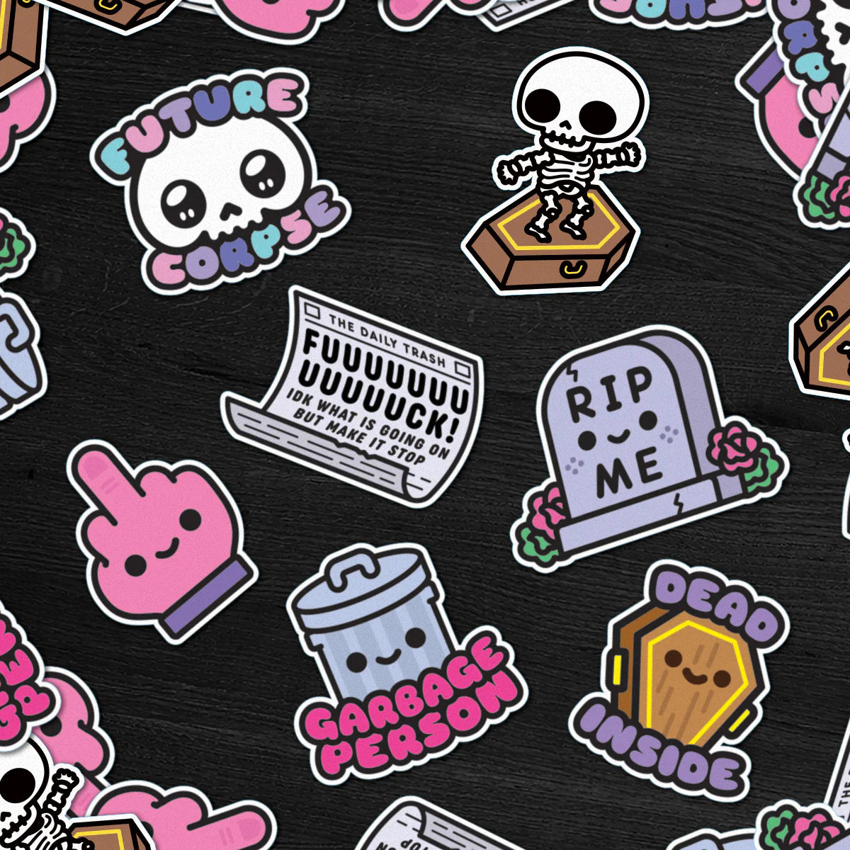 These cute, pastel goth-style vinyl stickers by 100% Soft feature phrases like “Future Corpse,” “Dead Inside,” and “Garbage Person,” alongside skeletons, gravestones, a trashcan, a pink middle finger, and a mock newspaper. With a matte finish that is both scratch- and weatherproof, the stickers are displayed on a dark background.