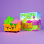 A 100% Soft Dumpster Fire Vinyl Figure shaped like a smiling dumpster with radioactive orange fire and goo sits next to its matching Dumpster Fire box, both displayed on a purple background.