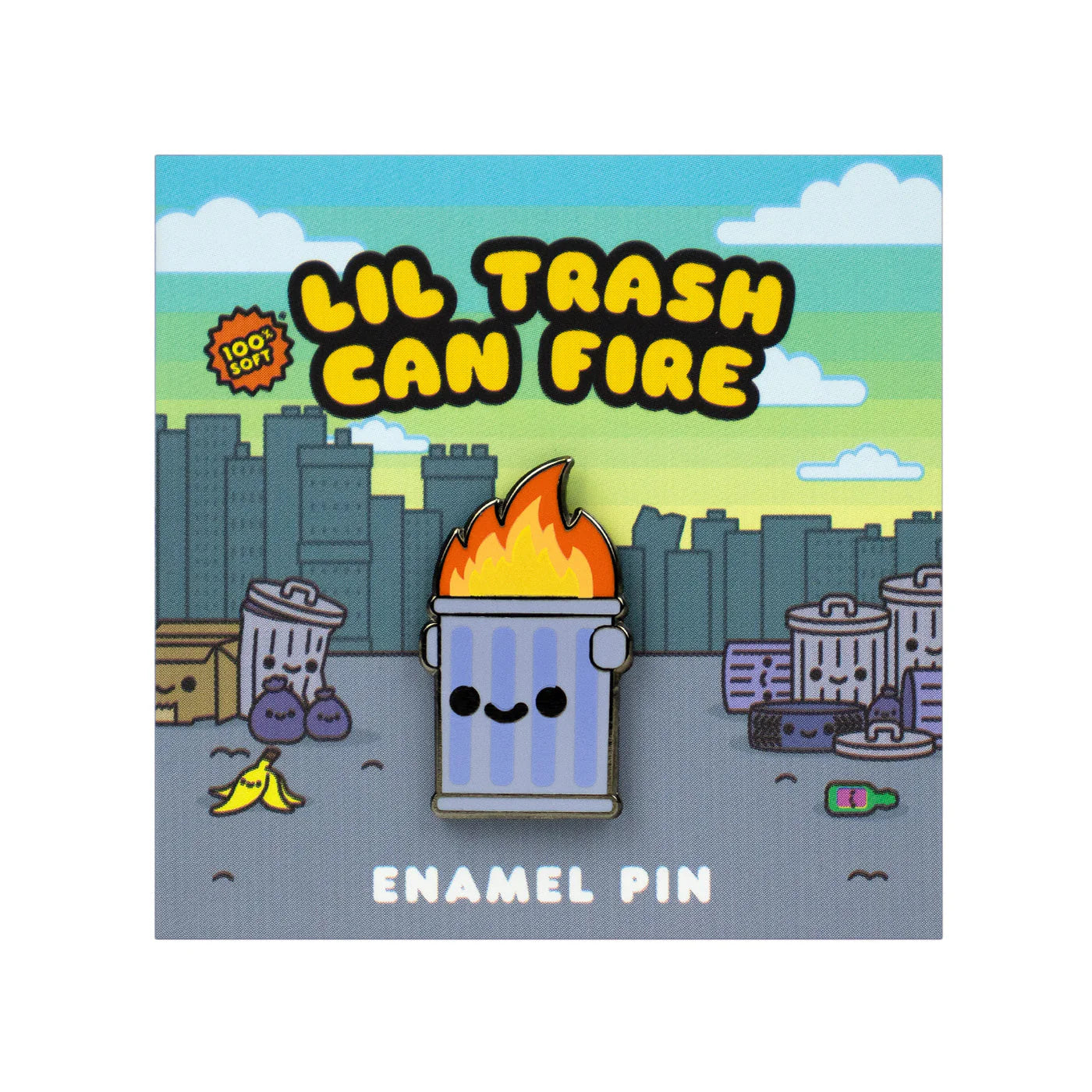 A cute 100% Soft soft enamel pin featuring a smiling trash can with flames, displayed on a backing card that reads “Lil Trash Can Fire” and shows cartoon trash cans, garbage, and a city skyline in the background.