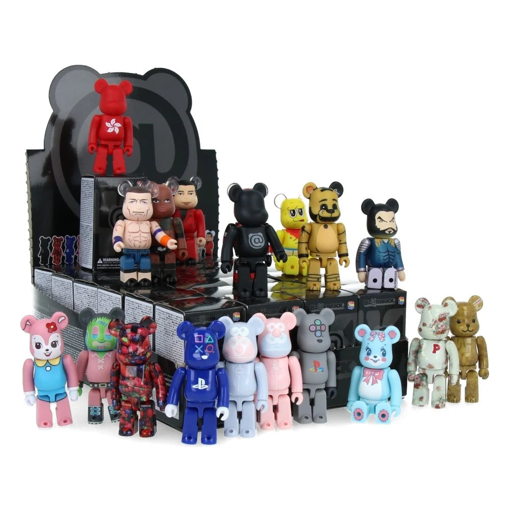 A group of colorful bear-shaped collectible figures from Medicom's Bearbrick Series 48 stands in front of a display box filled with more figures arranged in rows, each blind box holding a surprise for eager collectors.
