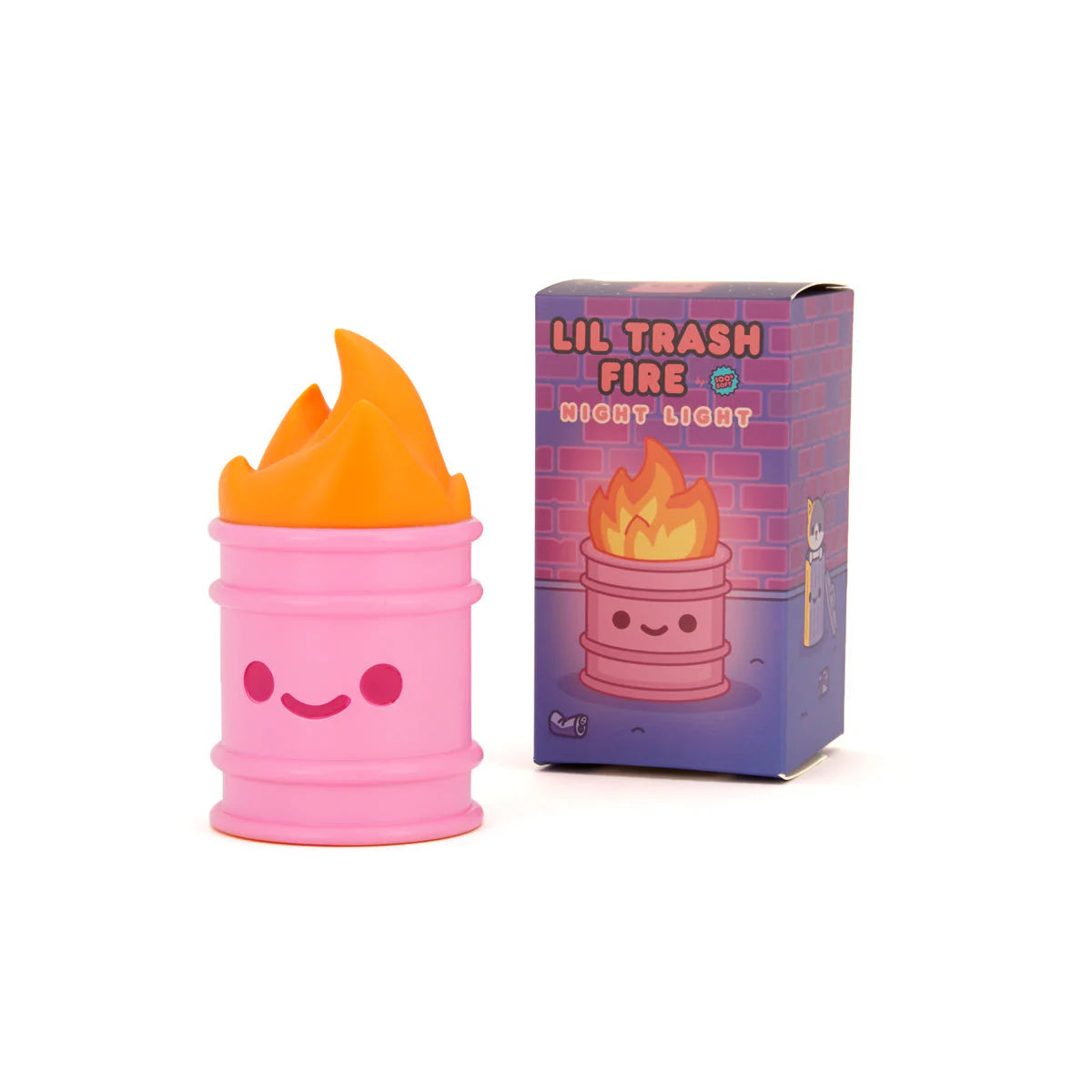 A pink barrel-shaped 100% Soft Lil Trash Fire night light with a smiling face and glowing orange flames sits beside its illustrated box. Rechargeable and charming, this night light is perfect for any room.