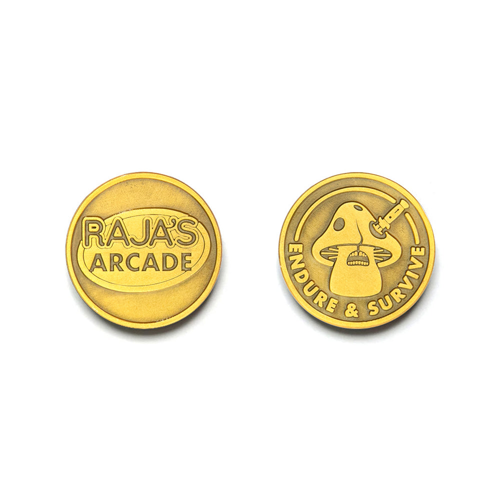 Two gold metal tokens by Bruce Yan: one side reads RAJAS ARCADE; the other features a mushroom with a syringe and ENDURE & SURVIVE around the edge.
