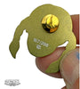 A hand holds a gold-colored ZOLTRON limited edition pin, shaped like a stylized head with long hair. The back displays a clasp, stamped 167/200, with the ZOLTRON logo above an art watermark.