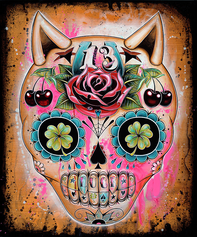 The design features a Caia Koopman-inspired sugar skull with a rose on the forehead, cherries and clovers in the eye sockets, and the number 13. A textured background of splattered pinks and browns enhances its mystical Lucky 13 charm.