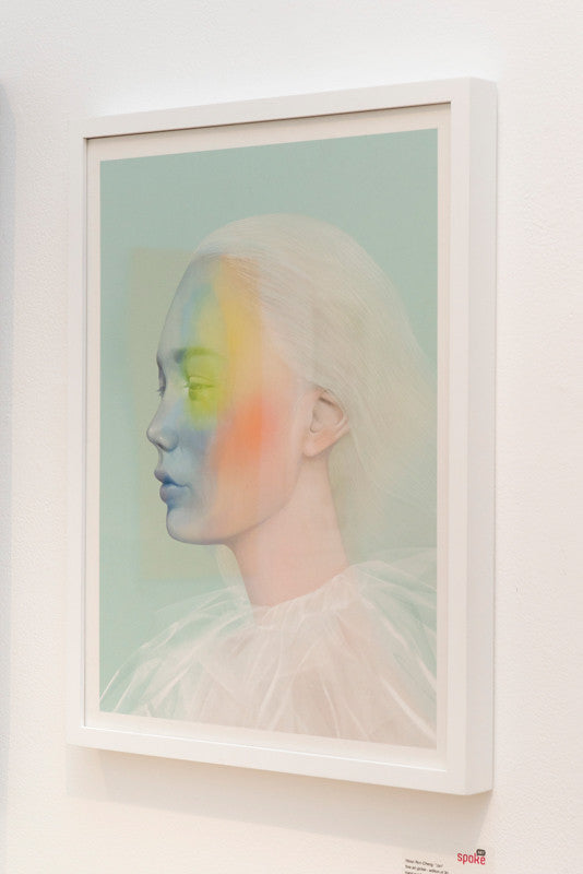 A serene-framed portrait by Hsiao Ron Cheng, in soft pastels of blue, orange, and yellow on a pale green background. The fine art giclée features a figure in a translucent white garment and is part of a hand-numbered edition.