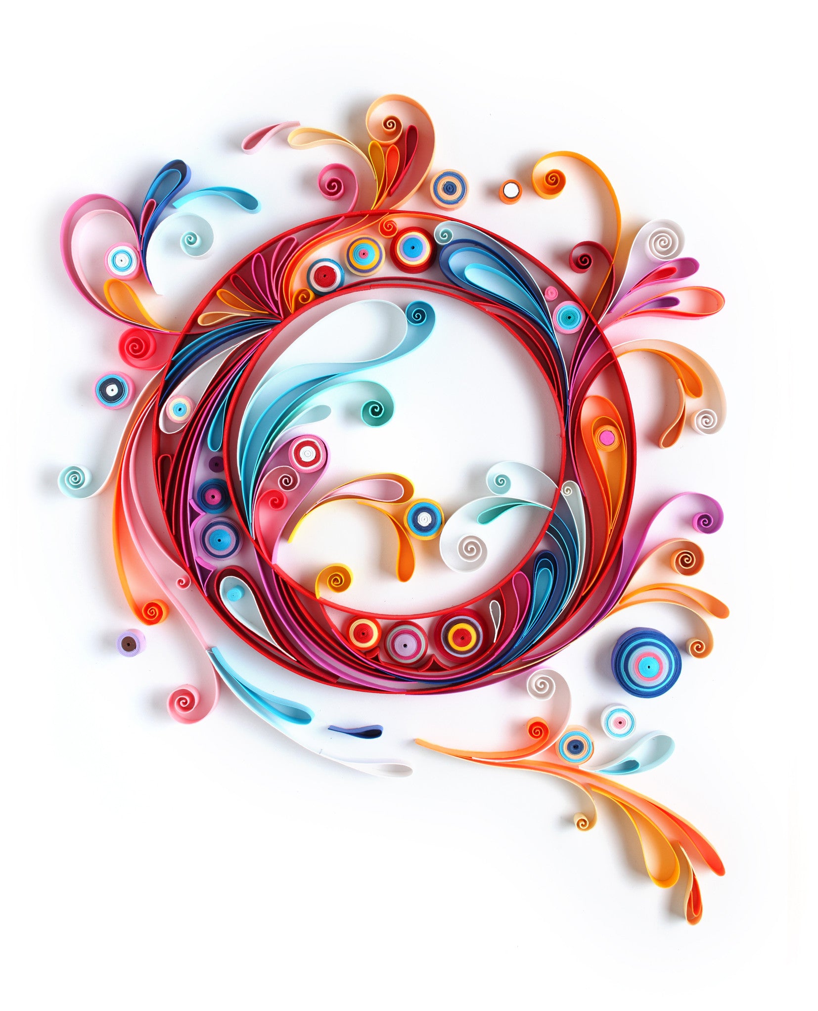 A swirling quilling circle, echoing Yulia Brodskayas style, features vibrant reds, blues, oranges, and pinks against a white background. This whimsical paper art is perfect for anyone seeking unique décor.