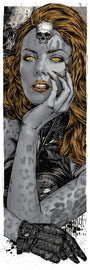 A woman with gray skin, glowing yellow eyes, and vibrant orange hair reminiscent of Rhys Cooper’s prints features a small skull on her forehead. Her gloved hand rests upon it against an abstract dark backdrop with hints of raven shadows.