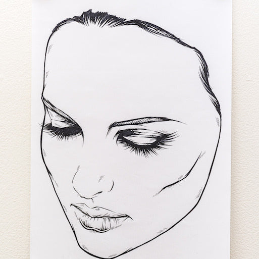 A black-and-white ink sketch by Rhys Cooper, clipped to a white wall, depicts a woman with detailed shading around her closed eyes and lips, conveying serenity.