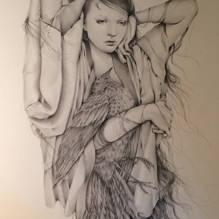A detailed pencil drawing depicts a serene woman with long hair intertwined with bird feathers, one arm raised and draped in flowing fabric. The composition blends human and avian elements, echoing Ozabus ethereal style.