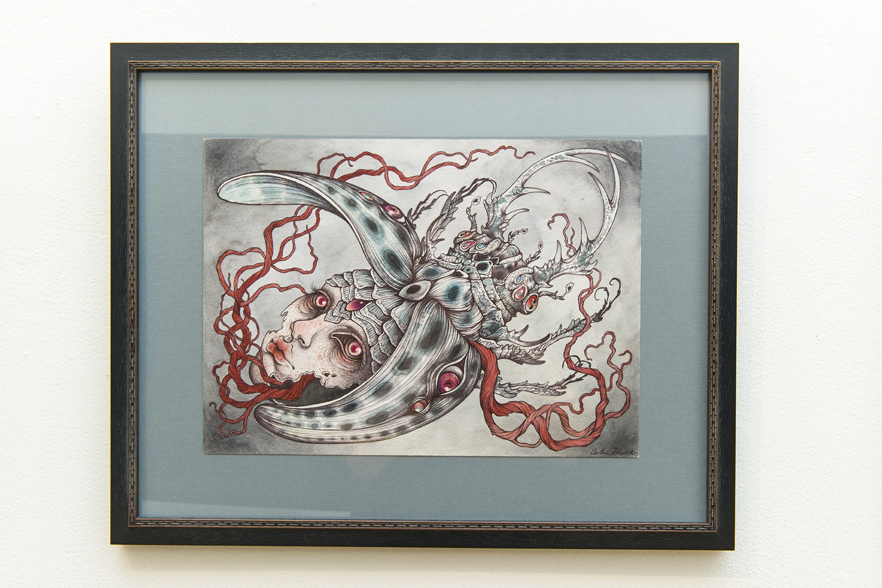 Illusions of Separation by Caitlin Hackett is framed artwork featuring surreal imagery of a crescent moon, ethereal figures, and flowing shapes. The composition blends fantasy and nature in muted colors and is available for sale.